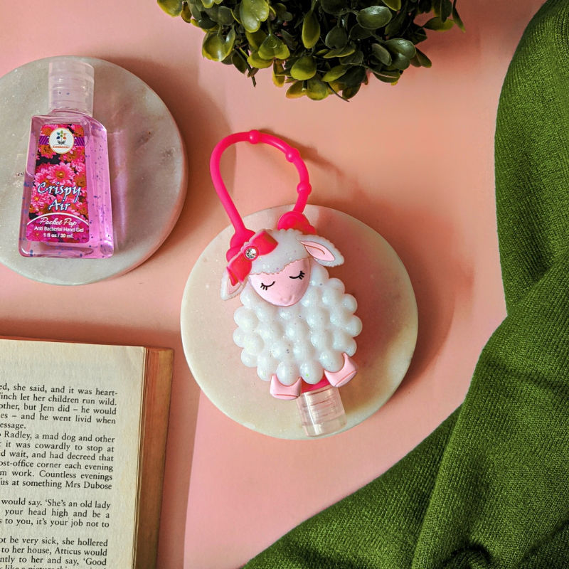 Lambie holder with sanitizer