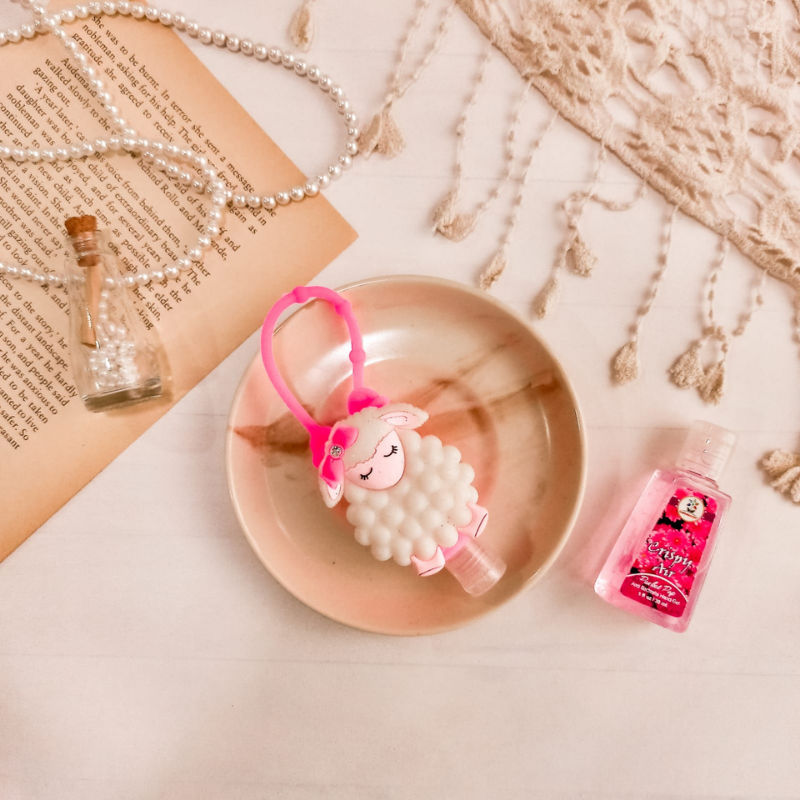 Lambie holder with sanitizer